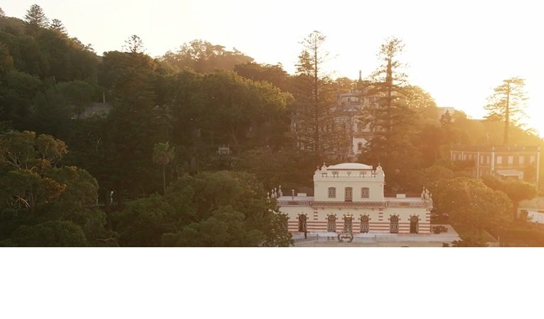 Sunset from the Serra — The palace catching the last light, folded into the Sintra hills.